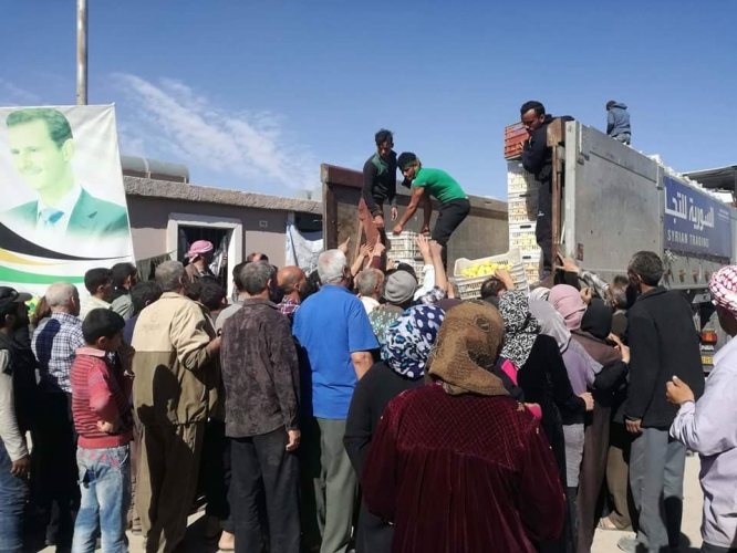 الأمم المتحدة والهلال الأحمر يوزعان المساعدات الفرنسية على أهالي الغوطة الشرقية 